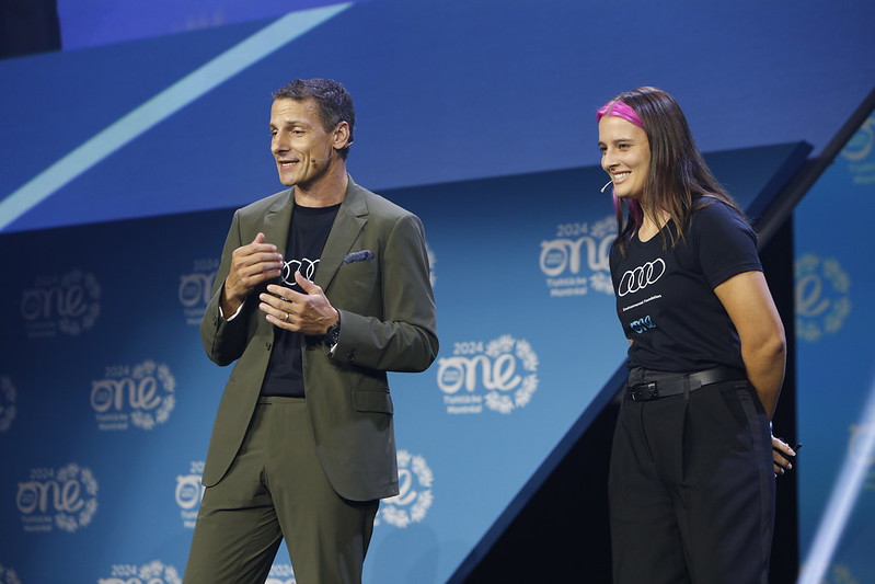 Daniel Weissland, President Audi America on stage with Franziska Trautmann, Co-Founder & CEO of Glass Half Full