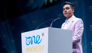Elvis Martin speaking at the One Young World Summit Manchester 2022
