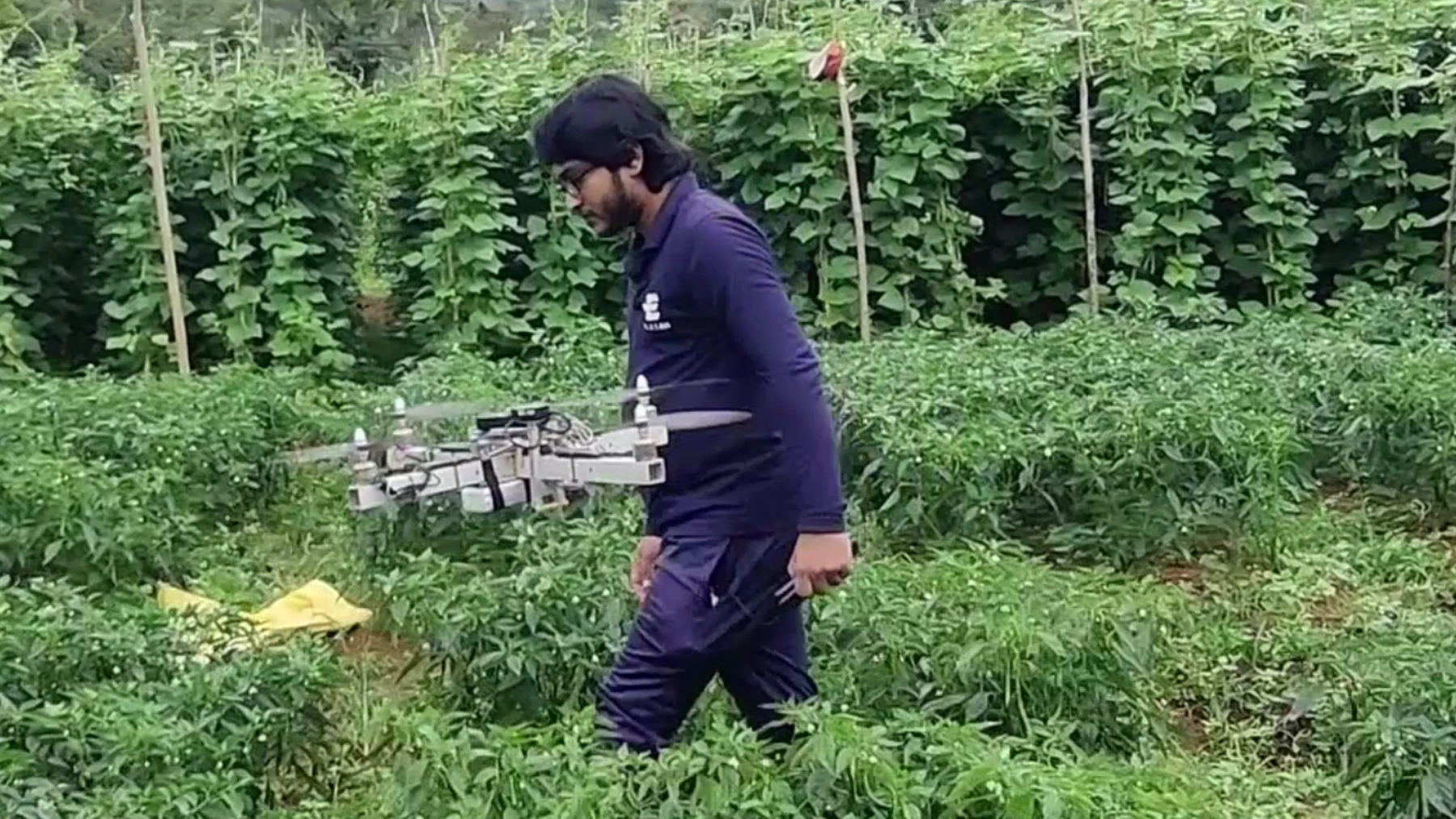 Lilan working in a field with a drone for Elzian Agro.