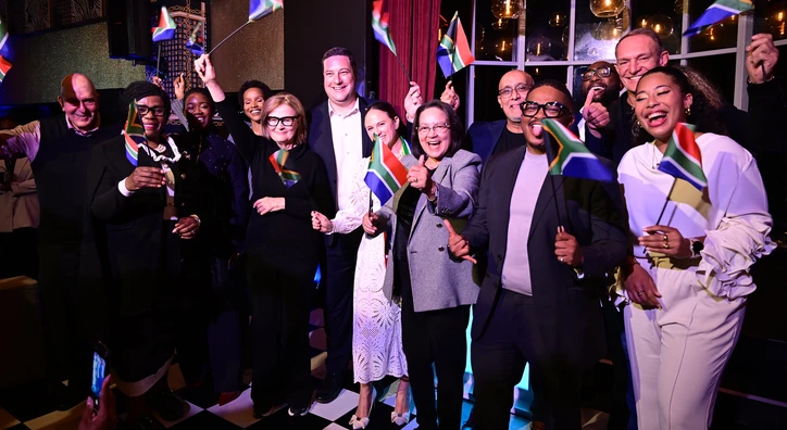 Group photo of OYW staff and affiliates announcing and celebrating the 2026 Cape Town Summit