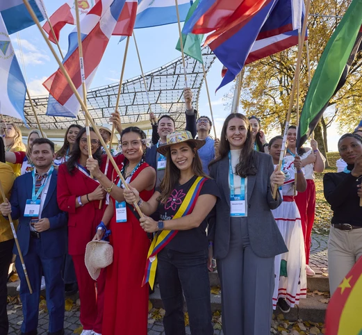 Delegates holding flags Munich 2025
